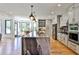 Modern kitchen with an oversized island, stainless steel appliances, and sleek cabinetry for a gourmet cooking experience at 237 Webney Se Dr, Marietta, GA 30068