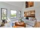Bright living room with hardwood floors, high ceiling, and view into kitchen at 237 Webney Se Dr, Marietta, GA 30068