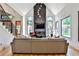 Cozy living room with vaulted ceilings, fireplace, and oversized windows at 237 Webney Se Dr, Marietta, GA 30068