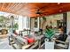 Covered patio with wood ceiling, ceiling fan, and outdoor seating area at 237 Webney Se Dr, Marietta, GA 30068