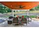 Covered patio with wood ceiling, ceiling fan, and outdoor seating area at 237 Webney Se Dr, Marietta, GA 30068
