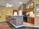 Inviting bar area with a counter, bar stools, cabinets, and a refrigerator at 2730 Vintage Reserve Ln, Marietta, GA 30066