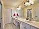 Bathroom features a double sink vanity, a large mirror, and plenty of storage space at 2730 Vintage Reserve Ln, Marietta, GA 30066