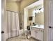 Bathroom features shower with curtain, hand rail, and white vanity with countertop space at 2730 Vintage Reserve Ln, Marietta, GA 30066