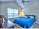 Cozy bedroom with a ceiling fan, a window with blinds, and a wooden dresser at 2730 Vintage Reserve Ln, Marietta, GA 30066