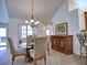 Inviting dining room with a chandelier and a view of the backyard through French doors at 2730 Vintage Reserve Ln, Marietta, GA 30066