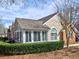 Charming home featuring a sunroom, well-maintained landscaping, and a cozy, inviting facade at 2730 Vintage Reserve Ln, Marietta, GA 30066