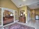 Welcoming hallway with decorative chest of drawers and doorway leading to a large dining area at 2730 Vintage Reserve Ln, Marietta, GA 30066
