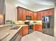 A well-equipped kitchen featuring stainless steel appliances, tile flooring, and ample storage at 2730 Vintage Reserve Ln, Marietta, GA 30066