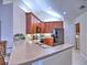 A modern kitchen with stainless steel appliances, wooden cabinets, and an open layout at 2730 Vintage Reserve Ln, Marietta, GA 30066