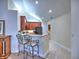 Modern kitchen featuring stainless steel appliances, dark wood cabinets, and breakfast bar seating at 2730 Vintage Reserve Ln, Marietta, GA 30066