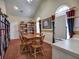 Comfortable meeting room with bookshelves, a table with chairs, and bright windows at 2730 Vintage Reserve Ln, Marietta, GA 30066