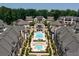 Breathtaking aerial view showcasing the community's pool, townhomes, and manicured landscaping at 6569 Beacon Dr, Sandy Springs, GA 30328