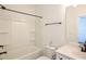 A clean bathroom with a tub, white vanity, and modern black fixtures at 6569 Beacon Dr, Sandy Springs, GA 30328