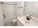 A clean bathroom featuring black fixtures and a tub with tile surround at 6569 Beacon Dr, Sandy Springs, GA 30328