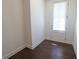 Bright entryway with dark hardwood flooring and a door with window and blinds at 6569 Beacon Dr, Sandy Springs, GA 30328
