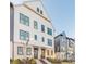 Stylish three-story townhome with brick and siding exterior and well-kept landscaping at 6569 Beacon Dr, Sandy Springs, GA 30328