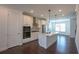 Modern kitchen with white cabinetry, stainless steel appliances, and a center island at 6569 Beacon Dr, Sandy Springs, GA 30328