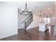 Open concept living area, featuring hardwood floors, modern lighting and view of the staircase at 6569 Beacon Dr, Sandy Springs, GA 30328