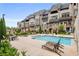 Inviting community pool with lounge chairs and tables, perfect for relaxation and socializing at 6569 Beacon Dr, Sandy Springs, GA 30328