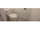 A powder room features a toilet, tile flooring, and a white sink at 6569 Beacon Dr, Sandy Springs, GA 30328