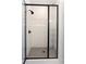 Walk-in shower featuring white subway tile, black fixtures, a black frame, and a grey tile floor at 6569 Beacon Dr, Sandy Springs, GA 30328