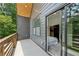 Exterior view of a private balcony, showcasing sliding glass doors leading to a bedroom with scenic views at 1792 Charles Nw Pl, Atlanta, GA 30318