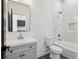 Stylish bathroom featuring marble-look tile, a gray vanity, and modern fixtures at 1792 Charles Nw Pl, Atlanta, GA 30318