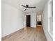 Hardwood floors, ceiling fan and a door leading to the bathroom at 1792 Charles Nw Pl, Atlanta, GA 30318