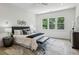 Bright main bedroom suite featuring a large bed, generous windows, and stylish decor at 1792 Charles Nw Pl, Atlanta, GA 30318