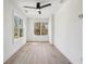 Bright bedroom featuring hardwood floors, two large windows, and a modern ceiling fan at 1792 Charles Nw Pl, Atlanta, GA 30318
