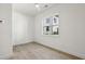 Bright, minimalist bedroom with hardwood floors and a large window at 1792 Charles Nw Pl, Atlanta, GA 30318