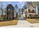 Modern homes with unique architectural design, black siding, and a manicured lawn at 1792 Charles Nw Pl, Atlanta, GA 30318