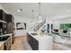 Open concept kitchen with a large island, stainless appliances, and seamless flow to living area at 1792 Charles Nw Pl, Atlanta, GA 30318