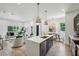 Bright and airy kitchen featuring a large island, modern appliances, and open living space at 1792 Charles Nw Pl, Atlanta, GA 30318