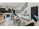 Open-concept space with modern furnishings, sleek black staircase, and stylish decor at 1792 Charles Nw Pl, Atlanta, GA 30318
