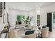 Inviting living room features ample seating, a decorative rug, and natural light at 1792 Charles Nw Pl, Atlanta, GA 30318