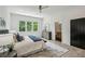 Bright main bedroom suite featuring a large bed, generous windows, and an en-suite bathroom at 1792 Charles Nw Pl, Atlanta, GA 30318
