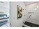Contemporary bathroom featuring walk-in shower with sleek glass enclosure and black hexagon floor tile at 1792 Charles Nw Pl, Atlanta, GA 30318