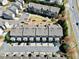An aerial view showcases well-maintained townhomes and community layout with accessible parking at 3022 Hartford Mill, Duluth, GA 30097