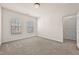 This bedroom has two windows, light colored walls, and neutral carpeting at 3022 Hartford Mill, Duluth, GA 30097