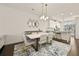 Stylish dining area with modern lighting and decor, seamlessly connected to the kitchen at 3022 Hartford Mill, Duluth, GA 30097