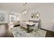 Chic dining space with hardwood floors and contemporary lighting, perfect for hosting at 3022 Hartford Mill, Duluth, GA 30097