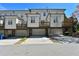 Exterior view of attached townhomes featuring rear decks and garages at 3022 Hartford Mill, Duluth, GA 30097