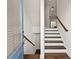 Inviting foyer features wood stairs, natural light, and a glimpse into the home's open layout at 3022 Hartford Mill, Duluth, GA 30097