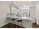 Well-lit kitchen with modern stools, granite countertops, and ample counter space at 3022 Hartford Mill, Duluth, GA 30097