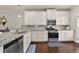 Modern kitchen with stainless steel appliances, granite countertops, and white cabinetry at 3022 Hartford Mill, Duluth, GA 30097