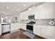 Bright kitchen featuring stainless steel appliances, granite countertops, and white cabinetry at 3022 Hartford Mill, Duluth, GA 30097