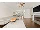Elegant living room featuring hardwood floors, a fireplace, and an open layout at 3022 Hartford Mill, Duluth, GA 30097