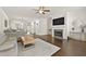 Open-concept living area with fireplace and hardwood floors, perfect for entertaining and relaxation at 3022 Hartford Mill, Duluth, GA 30097